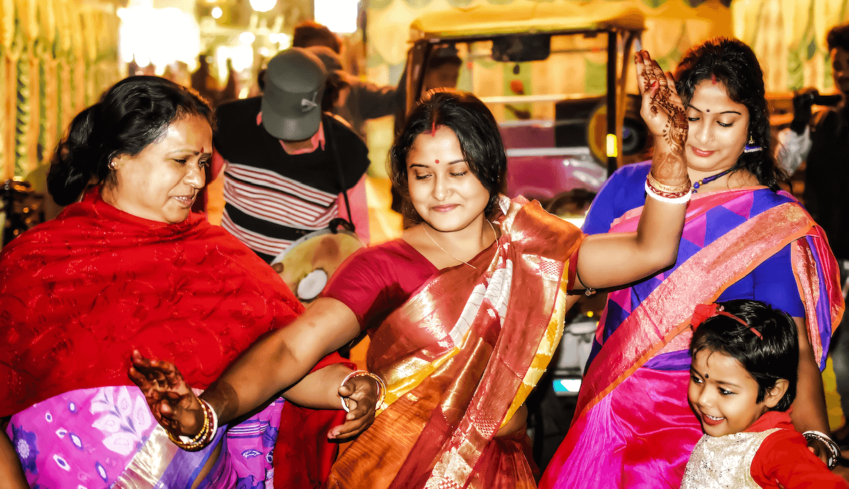 Indian women dance at an Indian wedding by parthab4